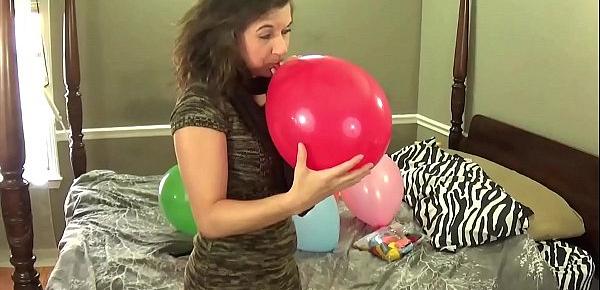  Blowing Balloons and Popping Them While Chewing Bubblegum
